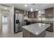 Modern kitchen with stainless steel appliances and an island at 6934 W Mclellan Rd, Glendale, AZ 85303