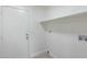 Laundry room with built-in shelving and hookups at 6934 W Mclellan Rd, Glendale, AZ 85303