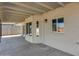 Covered patio with multiple windows and light fixture at 6934 W Mclellan Rd, Glendale, AZ 85303