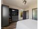 Bedroom with large closet and window overlooking trees at 727 E Portland St # 23, Phoenix, AZ 85006