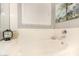 Relaxing bathroom with an oval bathtub and a window at 731 E Las Colinas Pl, Chandler, AZ 85249