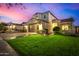 Two-story house with a brown garage door and landscaped yard at 731 E Las Colinas Pl, Chandler, AZ 85249