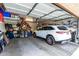 Garage with car, bicycle, and storage shelves at 731 E Las Colinas Pl, Chandler, AZ 85249