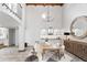 Elegant dining room featuring a wood table and statement chandelier at 8462 N 84Th Pl, Scottsdale, AZ 85258