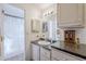 Bright bathroom with single sink vanity, shower/tub combo, and linen closet at 8865 E Baseline Rd # 1106, Mesa, AZ 85209