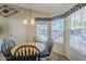 Bright dining area with a round table and four chairs, near a large window at 8865 E Baseline Rd # 1106, Mesa, AZ 85209