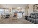 Kitchen with an island, light cabinets, and a dining area at 8865 E Baseline Rd # 1106, Mesa, AZ 85209