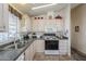 Well-equipped kitchen featuring ample counter space and skylights at 8865 E Baseline Rd # 1106, Mesa, AZ 85209