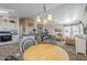 Open concept kitchen and dining area with ample cabinetry and a breakfast bar at 8865 E Baseline Rd # 1106, Mesa, AZ 85209