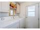 Laundry room with washer, dryer, and cabinets at 8865 E Baseline Rd # 1106, Mesa, AZ 85209