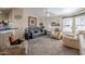 Spacious living room with recliner chairs and a large TV at 8865 E Baseline Rd # 1106, Mesa, AZ 85209