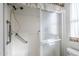 Clean shower with grab bars and sliding glass door at 8865 E Baseline Rd # 1106, Mesa, AZ 85209