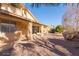 House with covered patio and gravel backyard at 10417 E Champagne Dr, Sun Lakes, AZ 85248