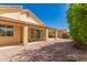 Charming backyard with patio and low-maintenance gravel landscaping, perfect for outdoor entertaining at 10417 E Champagne Dr, Sun Lakes, AZ 85248