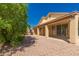 Spacious backyard with a covered patio and gravel landscaping at 10417 E Champagne Dr, Sun Lakes, AZ 85248