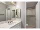 Bathroom featuring framed mirror, single sink and glass-enclosed shower at 10417 E Champagne Dr, Sun Lakes, AZ 85248