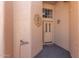 Inviting front door entrance with a decorative sunflower and a welcome sign at 10417 E Champagne Dr, Sun Lakes, AZ 85248