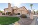 Charming single-Gathering home with desert landscaping, stucco exterior, and a two-car garage at 10417 E Champagne Dr, Sun Lakes, AZ 85248