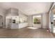 Open concept kitchen with white cabinets, stainless steel appliances, and ample counter space at 10417 E Champagne Dr, Sun Lakes, AZ 85248