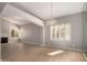 Spacious living room with fireplace, abundant natural light, and chandelier at 10417 E Champagne Dr, Sun Lakes, AZ 85248