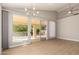 The home's living room offers recessed lighting, a ceiling fan, backyard views, and a sliding glass door at 10417 E Champagne Dr, Sun Lakes, AZ 85248