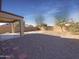Desert landscape backyard with covered patio at 10958 E Secret Mine Ct, Gold Canyon, AZ 85118
