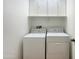 Laundry room with washer, dryer, and cabinets at 10958 E Secret Mine Ct, Gold Canyon, AZ 85118