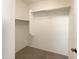 Large walk-in closet with shelving and carpet at 10958 E Secret Mine Ct, Gold Canyon, AZ 85118