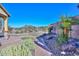 Landscaped backyard with putting green and desert plants at 12128 W Desert Mirage Dr, Peoria, AZ 85383