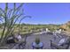 Landscaped backyard with seating area and fire pit at 12128 W Desert Mirage Dr, Peoria, AZ 85383
