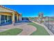 Spacious backyard with fire pit and artificial turf at 12128 W Desert Mirage Dr, Peoria, AZ 85383
