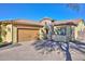 Front view of home with driveway at 12128 W Desert Mirage Dr, Peoria, AZ 85383