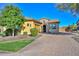 Spanish style home with landscaped yard at 12128 W Desert Mirage Dr, Peoria, AZ 85383