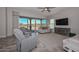 Living room with fireplace and sliding doors at 12128 W Desert Mirage Dr, Peoria, AZ 85383