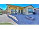 Covered patio with fire pit and brick pavers at 12128 W Desert Mirage Dr, Peoria, AZ 85383