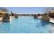 Resort-style pool with fountains and stone accents at 12128 W Desert Mirage Dr, Peoria, AZ 85383