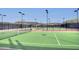 Well-lit tennis courts with ample space at 12128 W Desert Mirage Dr, Peoria, AZ 85383