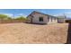 Backyard featuring a new home and a blank canvas for landscaping at 12358 W Marguerite Ave, Avondale, AZ 85323