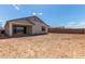Open backyard with a covered patio, awaiting personalization and landscaping at 12358 W Marguerite Ave, Avondale, AZ 85323
