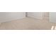 Bedroom with neutral carpet, white walls, and a view into an adjacent bathroom at 12358 W Marguerite Ave, Avondale, AZ 85323