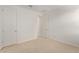 New carpet in a bedroom with two doors, and white walls at 12358 W Marguerite Ave, Avondale, AZ 85323