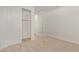 This bedroom features a closet, carpet, white walls, and an open door at 12358 W Marguerite Ave, Avondale, AZ 85323