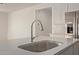 Close up of stainless steel sink and faucet with white countertop at 12358 W Marguerite Ave, Avondale, AZ 85323