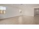 Bright living room with light-colored tile flooring and windows for natural light at 12358 W Marguerite Ave, Avondale, AZ 85323
