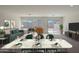 Bright dining room with marble table and view of backyard at 1337 W Inca Dr, Coolidge, AZ 85128