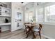 Small breakfast nook with wood table and built-in shelving at 14223 W Rico Dr, Sun City West, AZ 85375