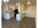 Modern kitchen with white cabinets and gray flooring at 1440 N Idaho Rd # 2092, Apache Junction, AZ 85119