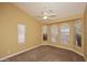 Bedroom with vaulted ceiling, ceiling fan and arched windows at 15709 E Palisades Blvd, Fountain Hills, AZ 85268