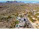 Aerial view of house with pool and backyard, situated in a desert mountain community at 15856 N Aspen Dr, Fountain Hills, AZ 85268