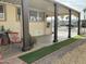 Covered patio with seating and artificial turf at 17200 W Bell Rd # 641, Surprise, AZ 85374